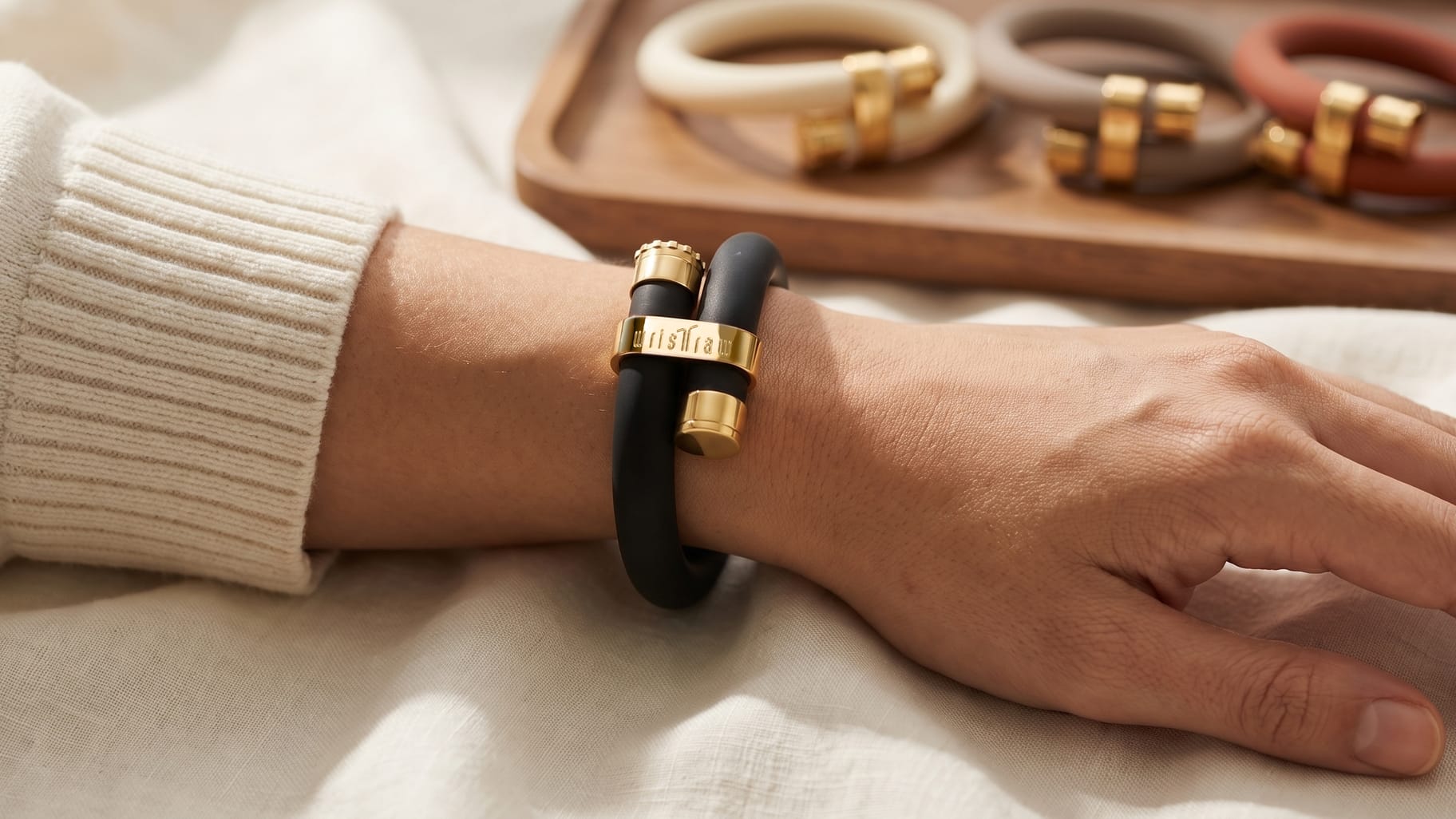 wristraw worn on the wrist, teal silicone with the five launch colorways in the background